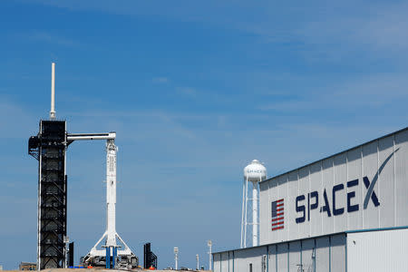 A SpaceX Falcon 9 carrying the Crew Dragon spacecraft sits on launch pad 39A prior to the uncrewed test flight to the International Space Station from the Kennedy Space Center in Cape Canaveral, Florida, U.S., March 1, 2019. REUTERS/Mike Blake