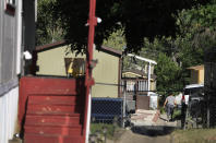 ADVANCE ON THURSDAY, SEPT. 12 FOR USE ANY TIME AFTER 3:01 A.M. SUNDAY SEPT 15 - In this Aug. 30th 2019 photo shows residents of Lamplighter Village, a manufactured and mobile home park, spending time outdoors in their community in Federal Heights, Colo. Across Colorado, where the housing crisis impacts both rural and urban towns, the strife between mobile home park residents and park owners approaches a boiling point. The business model -- in which homeowners pay lot rent to park their houses on someone else's land -- capitalizes on the immobility and economic fragility of tenants who often can't afford to move or live anywhere else.(Kathryn Scott/The Colorado Sun)