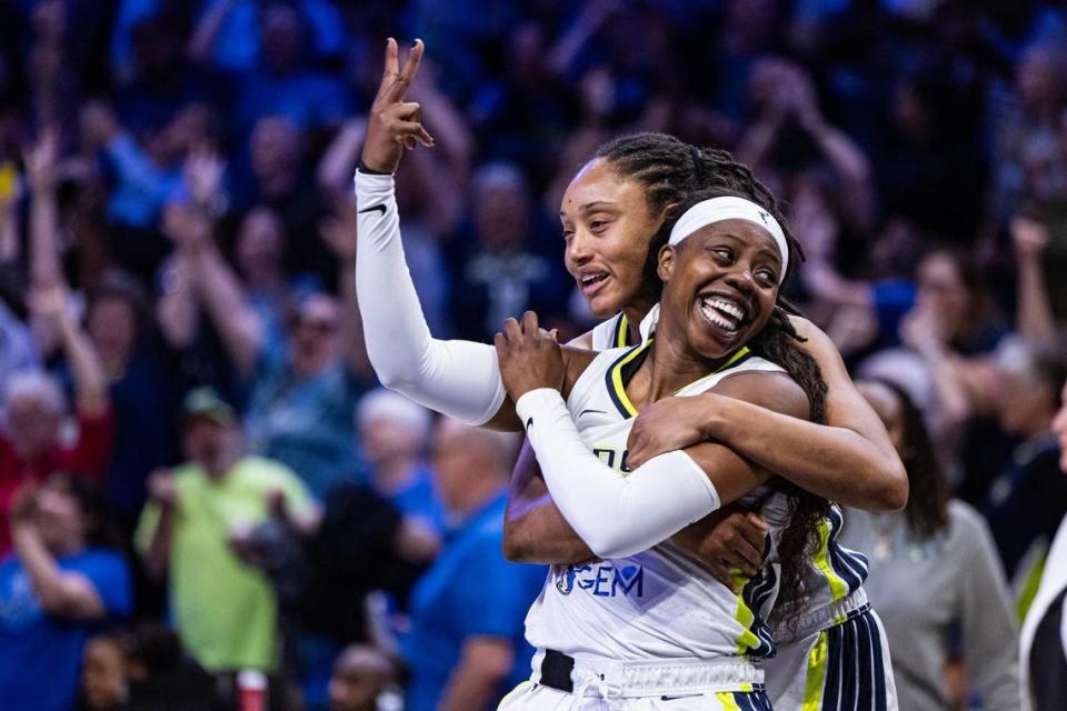 Dallas Wings guard Arike Ogunbawale (24) celebrates with her teammate Jaelyn Brown (18) after making the game-winning, three-point shot in the fourth quarter of a WNBA preseason game between the Dallas Wings and Indiana Fever at College Park Center in Arlington on Friday, May 3, 2024.