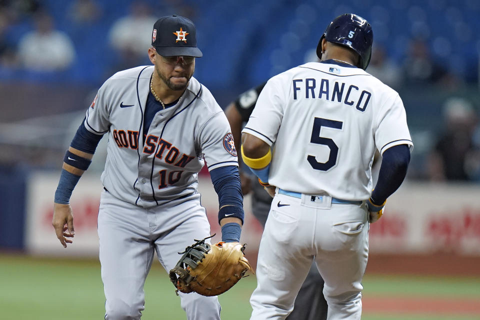 Houston Astros first baseman Yuli Gurriel (10) tags out Tampa Bay Rays' Wander Franco (5) after grounding out during the first inning of a baseball game Wednesday, Sept. 21, 2022, in St. Petersburg, Fla. (AP Photo/Chris O'Meara)