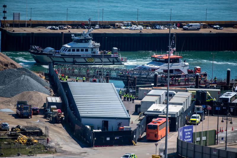 Migrants arrive in the UK after crossing the English Channel