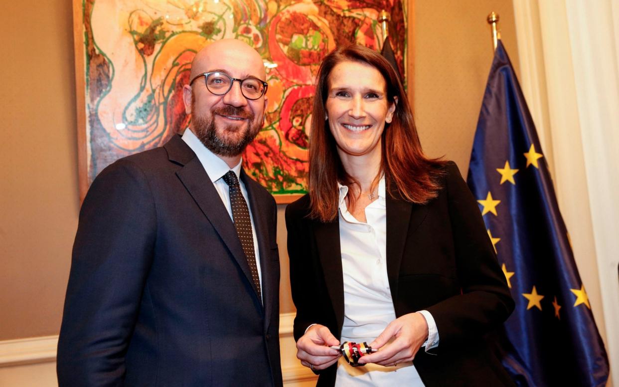 Belgian outgoing Prime Minister Charles Michel and Sophie Wilmès, Belgium's first female prime minister.  - AFP