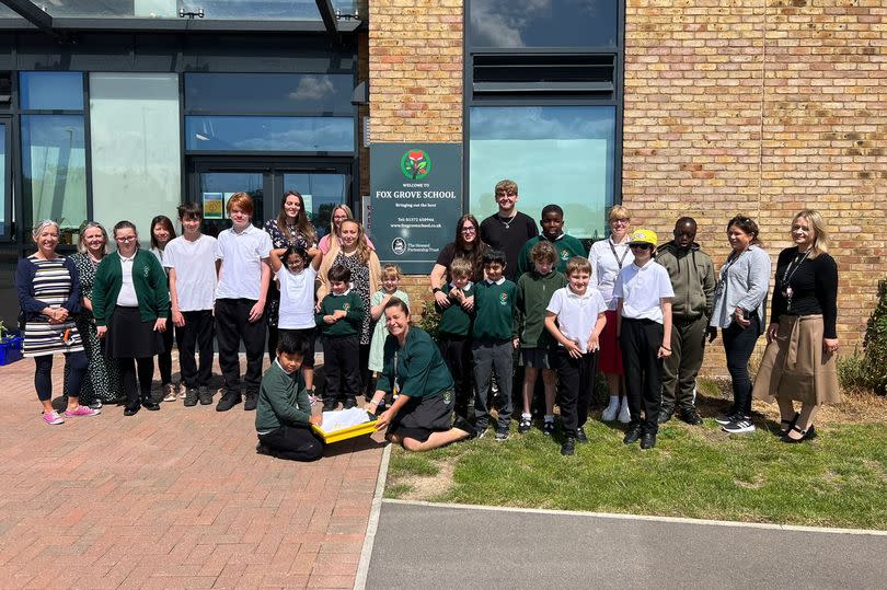 Pupils outside the school