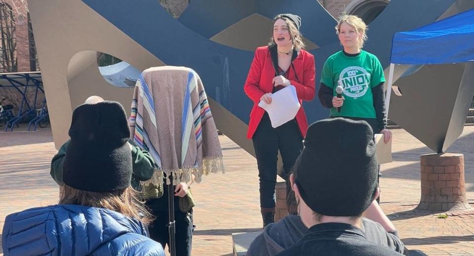 Union representatives Lexy Aydelotte, left, and Mirabelle Lemieux rallied students and workers from several unions at Western Washington University on Thursday in Red Square.