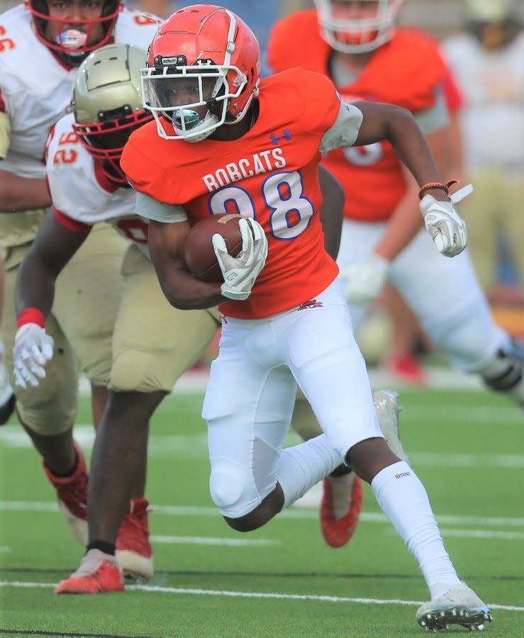 San Angelo Central High School running back Jayvion Robinson fights for yardage during a scrimmage against Lubbock Coronado at San Angelo Stadium on Thursday, Aug. 18, 2022.