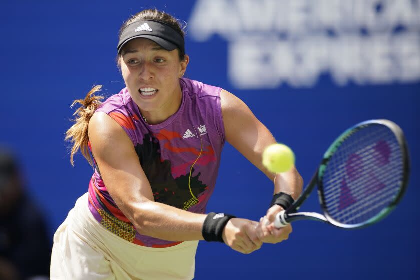 Jessica Pegula, of the United States, returns a shot to Yuan Yue, of China.