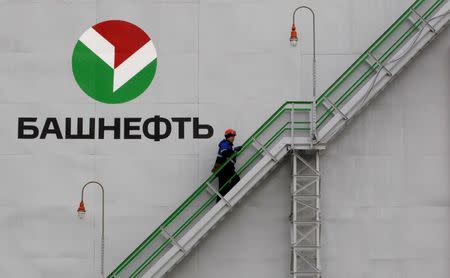 An employee walks up stairs at Bashneft - Novoil refinery in the city of Ufa, Russia, April 11, 2013. REUTERS/Sergei Karpukhin/File Photo