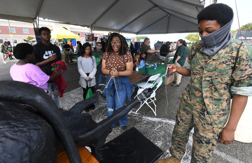 Oct 13, 2022; Tuscaloosa, AL, USA; Paul Bryant High students Latrina Rattiliff and Jordan Turner deliver a simulated calf at the Agricultural Extension Service display during the West Alabama Works Worlds of Work expo at Shelton State. 