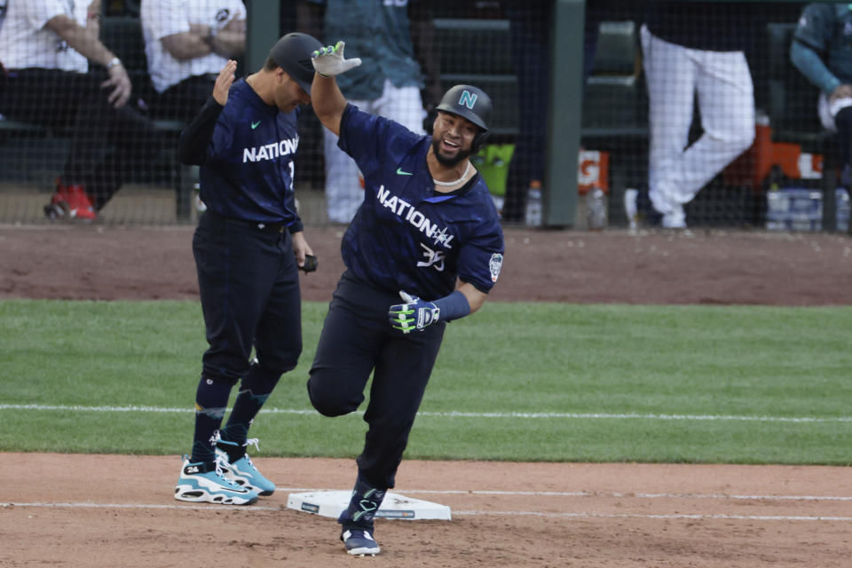 National League's Elias Díaz, of the Colorado Rockies (35), rounds first base on his two run home run in the eighth inning during the MLB All-Star baseball game in Seattle, Tuesday, July 11, 2023. (AP Photo/John Froschauer)