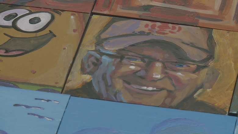 Islanders contribute to a mural mosaic marking Canada's 150th