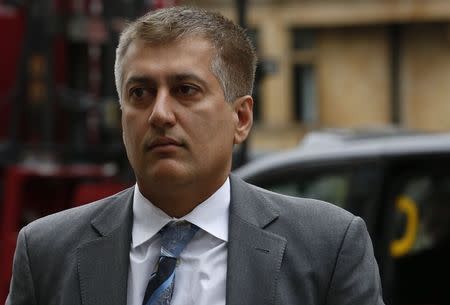 Former Barclay's trader Jay Merchant arrives at Westminster Magistrates Court in London May 27, 2014. REUTERS/Luke MacGregor