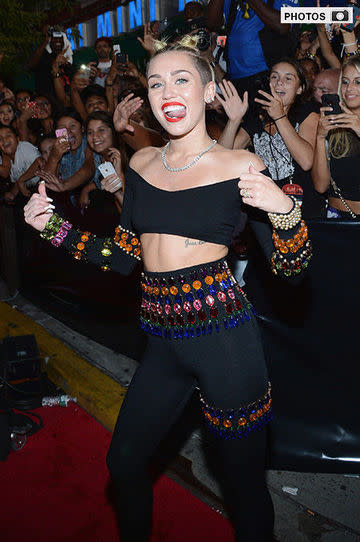 Miley Cyrus, MTV VMAs, tongue out, red carpet.