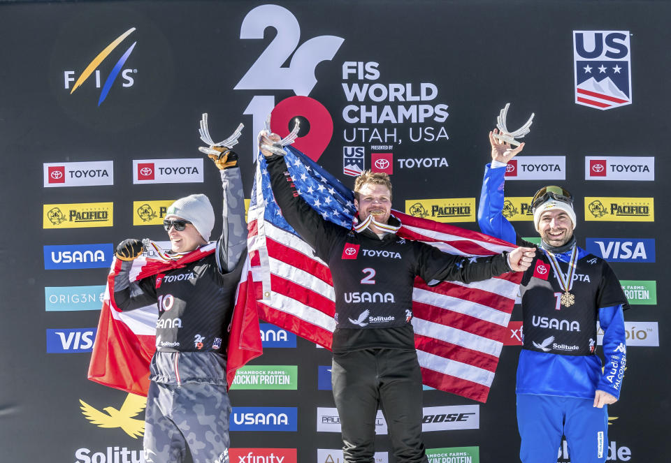 Silver medalist Hanno Douschan, left, of Austria, gold medalist Mick Dierdorff, center, of the United States, and bronze medalist Emanuel Perathoner, of Italy, celebrate on the podium after the men's snowboard cross final at the Freestyle Ski and Snowboard World Championships, Friday, Feb. 1, 2019, in Solitude, Utah. (AP Photo/Tyler Tate)