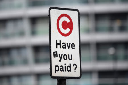 FILE PHOTO: A sign indicating the beginning of the congestion charging zone in London, Britain, January 31, 2018. REUTERS/Toby Melville/File Photo