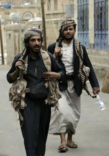 Fighters loyal to Yemeni tribal leader Sadiq al-Ahmar guard the area around his family home in the al-Hasaba neighbourhood of north Sanaa. Security forces in the Yemeni capital battled heavily armed supporters of the country's most powerful tribal leader on Thursday as President Ali Abdullah Saleh ordered the tribesman's arrest