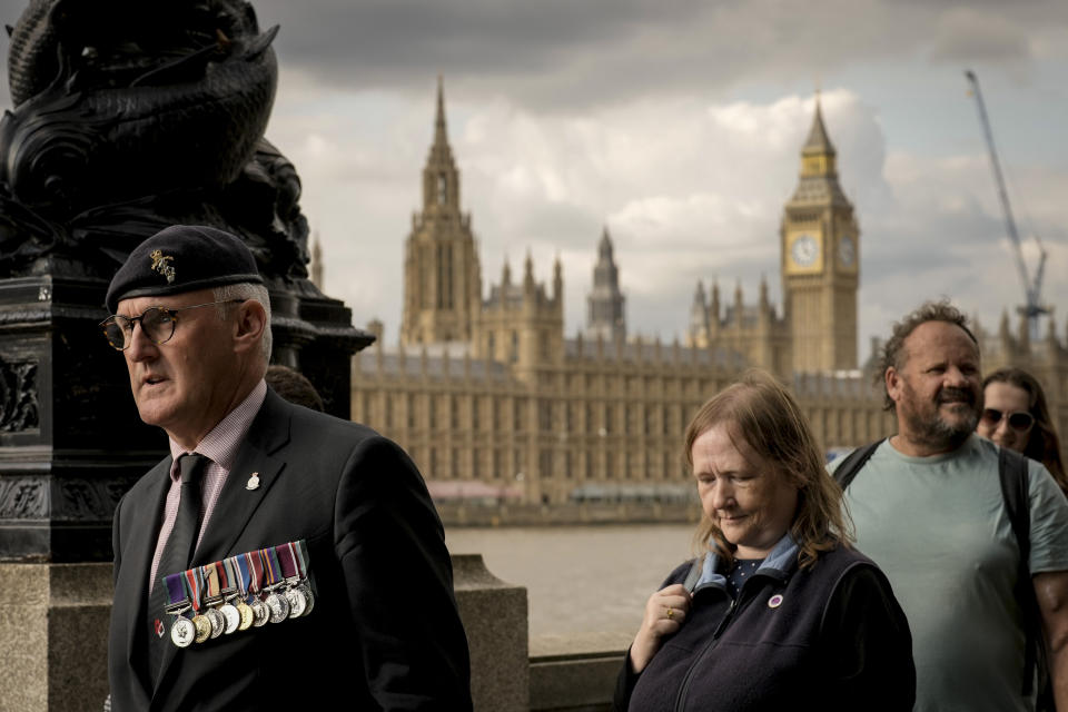 People wait in line to pay tribute to Queen Elizabeth II in Central London, Thursday, Sept. 15, 2022. The Queen will lie in state in Westminster Hall for four full days before her funeral on Monday Sept. 19. (AP Photo/Vadim Ghirda)