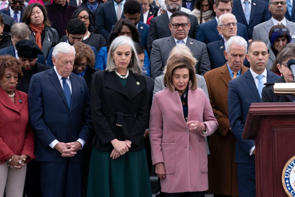 House Democratic leaders pause for a moment of silence during a ceremony marking the second anniversary of the Jan. 6 attacks on the Capitol.