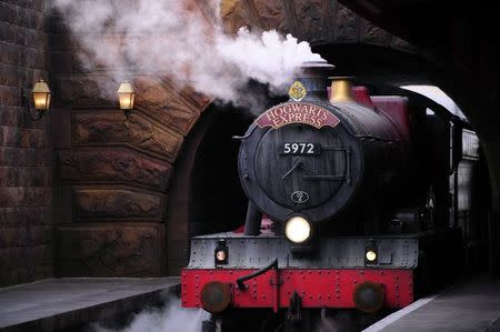 The Hogwarts Express train, which connects the Universal Studios with neighboring Islands of Adventure, pulls into the Hogsmeade Station during a media preview for The Wizarding World of Harry Potter-Diagon Alley at the Universal Orlando Resort in Orlando, Florida June 19, 2014. REUTERS/David Manning