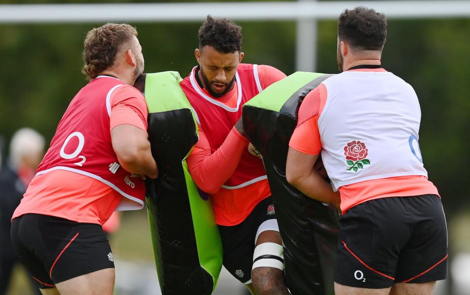  Courtney Lawes of England runs into a tackle bag during the England Training Session at The Lensbury on September 28, 2021 in Teddington, England - GETTY IMAGES