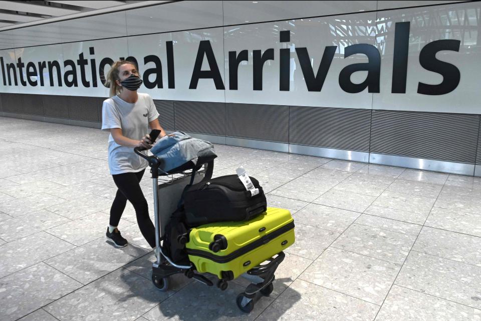 A passenger arrives at HeathrowAFP via Getty Images