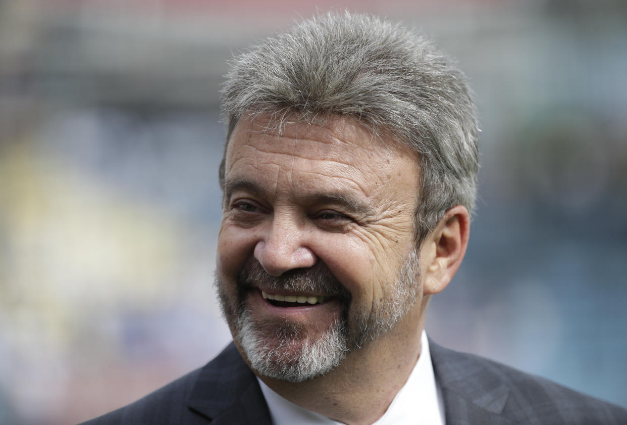 Los Angeles Dodgers general manager Ned Colletti smiles before a baseball game between the Los Angeles Dodgers and the San Francisco Giants on Friday, April 4, 2014, in Los Angeles. (AP Photo/Jae C. Hong)