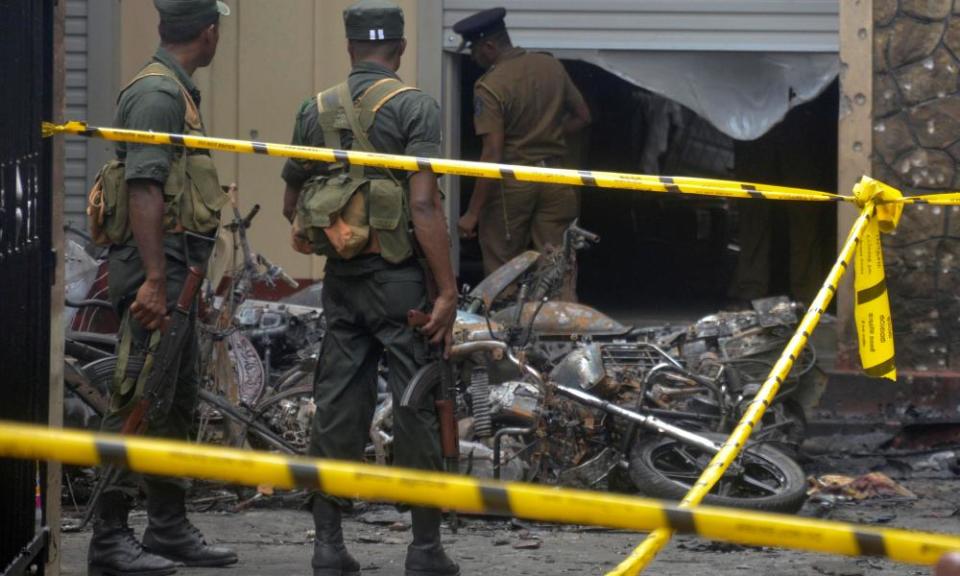 Sri Lankan military stand guard near the explosion site in Batticaloa