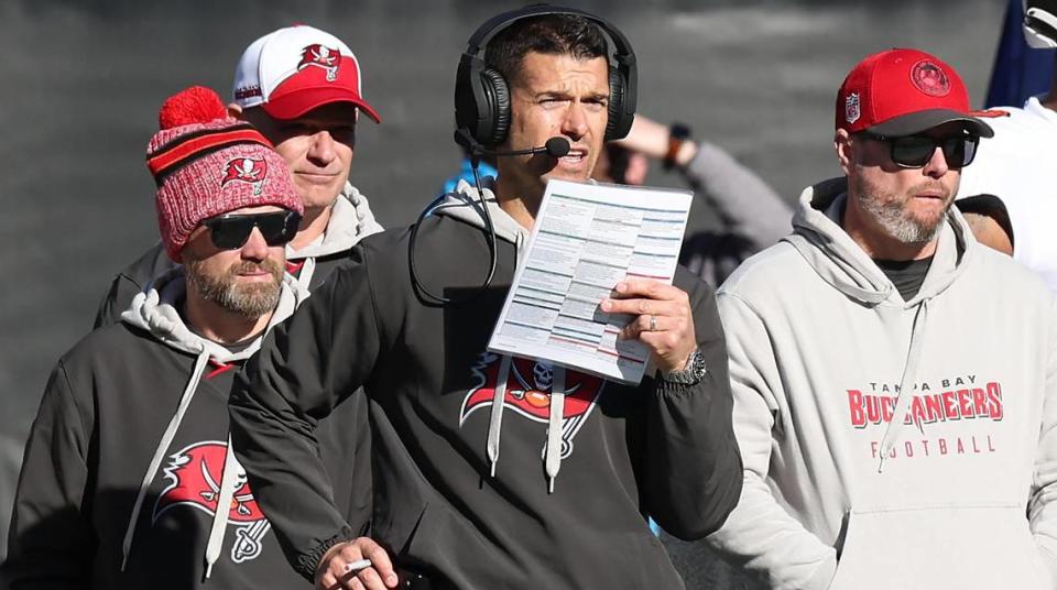 Tampa Bay Buccaneers offensive coordinator Dave Canales, center, stands along the team’s sideline during action against the Carolina Panthers at Bank of America Stadium in Charlotte, NC on Sunday, January 7, 2024. The Buccaneers defeated the Panthers 9-0.