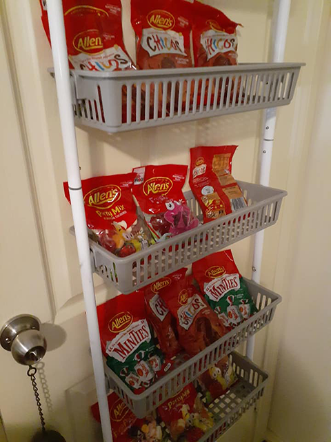 Image of Kmart Over the Door Basket Organiser used to house Allen's lollies