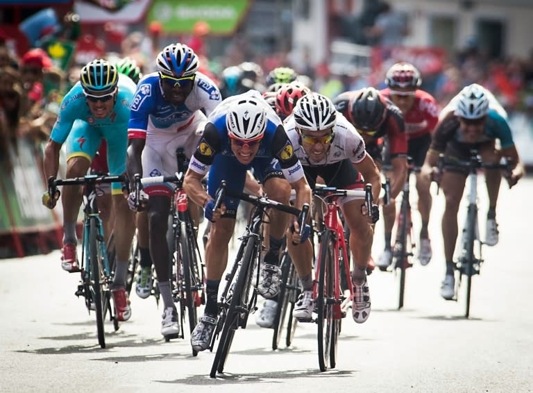 Etixx-Quickstep' Begium cyclist Gianni Meersman (C) sprints to win during the fifth stage of the 71st edition of "La Vuelta" Tour of Spain, a 171.3 km route between Viveiro and Lugo, on August 23, 2016