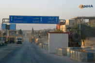 In this image provided by Hawar News Agency, ANHA, a line of U.S. military vehicles travel down a main road in northeast Syria, Monday, Oct. 7, 2019. U.S.-backed Kurdish-led forces in Syria said American troops began withdrawing Monday from their positions along Turkey's border in northeastern Syria, ahead of an anticipated Turkish invasion that the Kurds say will overturn five years of achievements in the battle against the Islamic State group. (ANHA via AP)