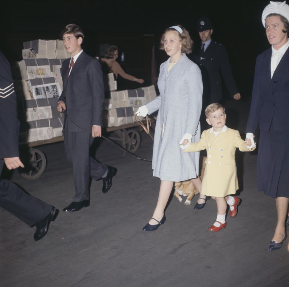 From left to right, Prince Charles, walking a corgi, Princess Anne, Prince Andrew and his nanny Mabel Anderson at Euston Station in London, UK, 8th August 1963. They are leaving for a holiday in Balmoral, Scotland. (Photo by Keystone/Hulton Archive/Getty Images)