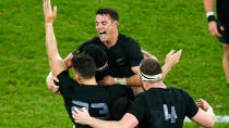 Dan Carter and the All Blacks celebrate at full time.