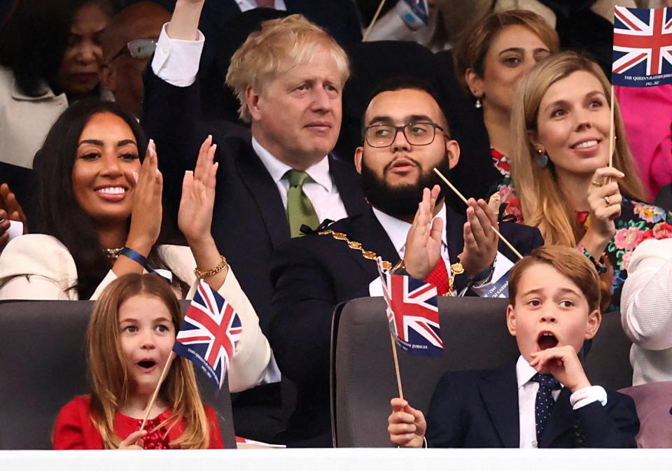 Britain's Princess Charlotte and Prince George react as they attend the BBC's Platinum Party at the Palace to celebrate the Queen's Platinum Jubilee in front of Buckingham Palace, among them are British Prime Minister Boris Johnson and his wife Carrie John, in London, Britain June 4, 2022. REUTERS/Henry Nicholls/Pool