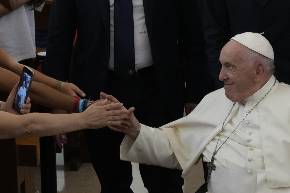 Pope Francis leaves the parish of Serafina at the end of a meeting with representatives of some aid and charity centers ahead of Sunday's 37th World Youth Day in Lisbon, Friday, Aug. 4, 2023. Francis is in Portugal through the weekend to preside over the jamboree that St. John Paul II launched in the 1980s to encourage young Catholics in their faith. The Argentine Jesuit has picked up John Paul's mantle with gusto as he seeks to inspire the next generation to rally behind his key social justice and environmental priorities.(AP Photo/Gregorio Borgia)