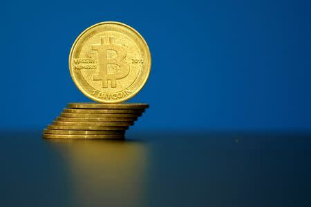 FILE PHOTO: An illustration photo of Bitcoin (virtual currency) coins are seen at La Maison du Bitcoin in Paris