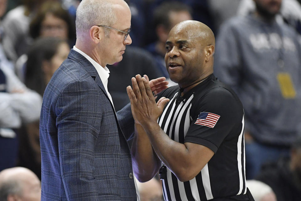 Official Jeff Anderson talks with UConn head coach Dan Hurley in the second half of an NCAA college basketball game against Xavier, Wednesday, Jan. 25, 2023, in Storrs, Conn. (AP Photo/Jessica Hill)