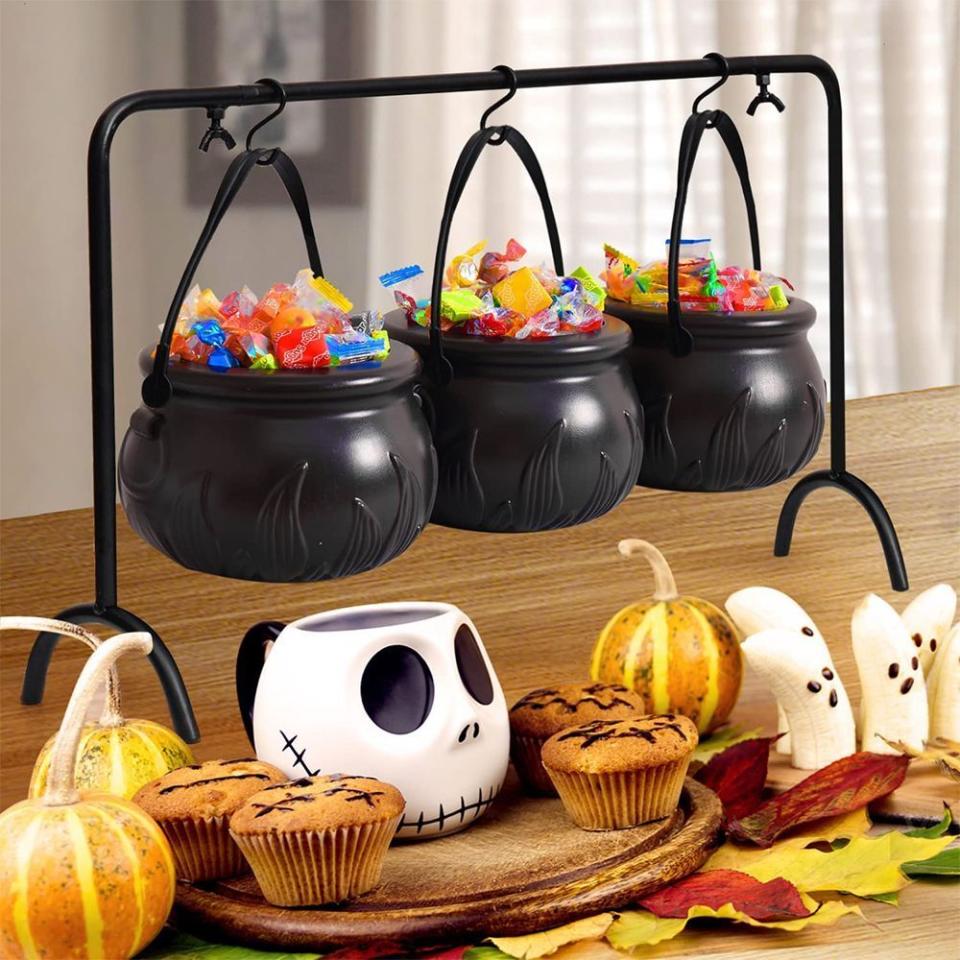 <p><strong>Rocinha</strong></p><p>amazon.com</p><p><strong>$29.99</strong></p><p>These witchy snack bowls will stand out in the graveyard of party snacks on your kitchen counter. Plus, it comes with a rack to prop up the three hanging cauldron bowls, perfect for holding tasty treats.</p>