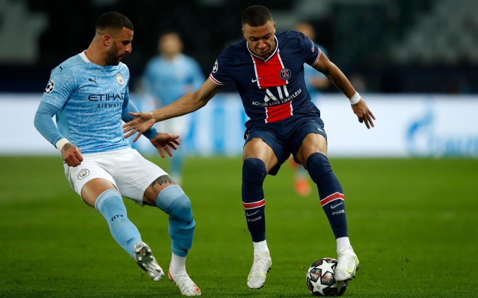 Manchester City's Kyle Walker (L) and Paris Saint Germain's Kylian Mbappe (R) in action during the UEFA Champions League semi final, first leg soccer match between PSG and Manchester City at the Parc des Princes stadium in Paris, France, 28 April 2021 - YOAN VALAT/EPA-EFE/Shutterstock