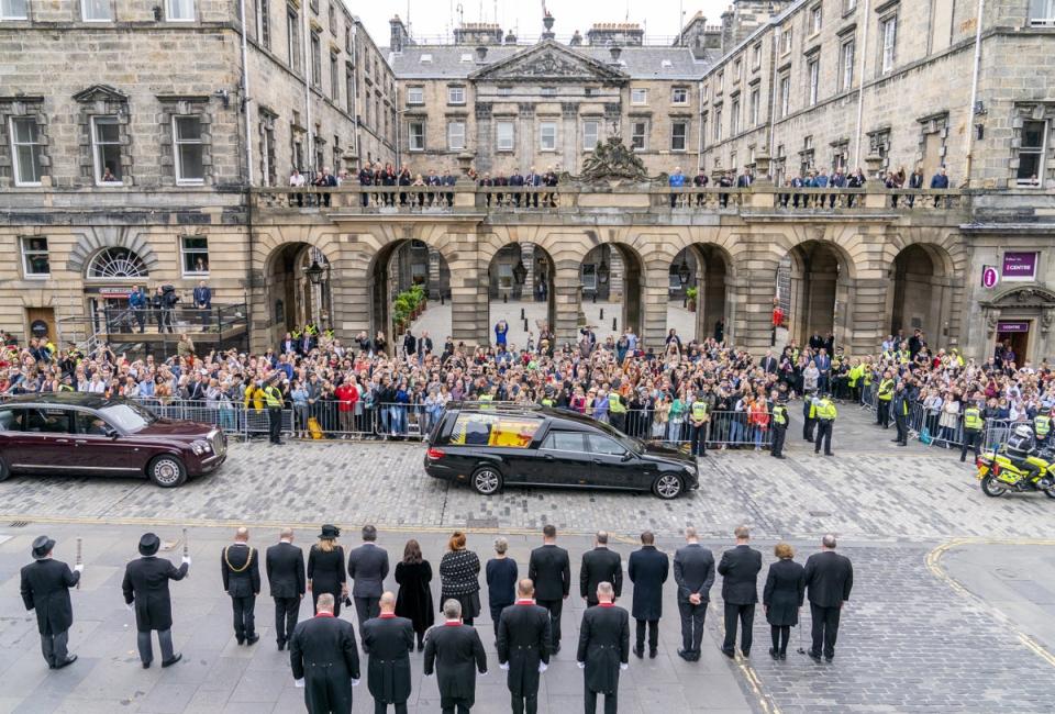 The hearse carrying the Queen’s coffin passes the City Chambers on the Royal Mile, Edinburgh (PA Wire)