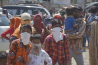 GHAZIABAD, INDIA - MARCH 28: Migrant workers seen at Lal Kuan bus stand on Day 4 of the 21 day nationwide lockdown -- to check the spread of coronavirus, on March 28, 2020 in Ghaziabad, India. (Photo by Sakib Ali/Hindustan Times via Getty Images)