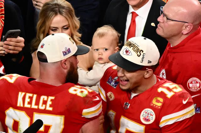 <p>PATRICK T. FALLON/AFP via Getty</p> Patrick Mahomes, Brittany Mahomes and son Bronze