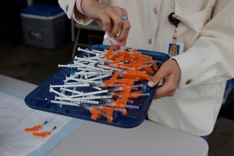 Residents line up for a COVID-19 vaccine clinic in Chelsea