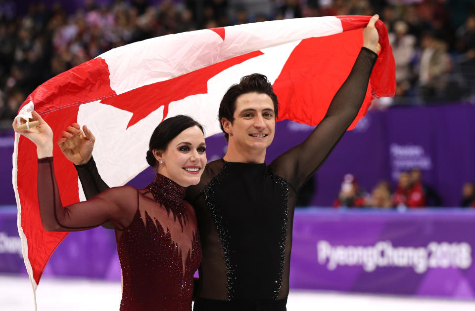 Virtue and Moir. Image via Getty Images. 