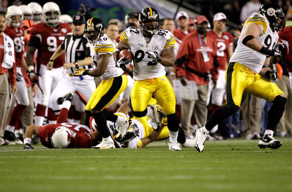 Pittsburgh Steelers linebacker James Harrison (92) returns the ball 100 yards for a touchdown after an interception in the second quarter against the Arizona Cardinals during Super Bowl XLIII, Sunday, Feb. 1, 2009, in Tampa, Fla. [The Associated Press/File]