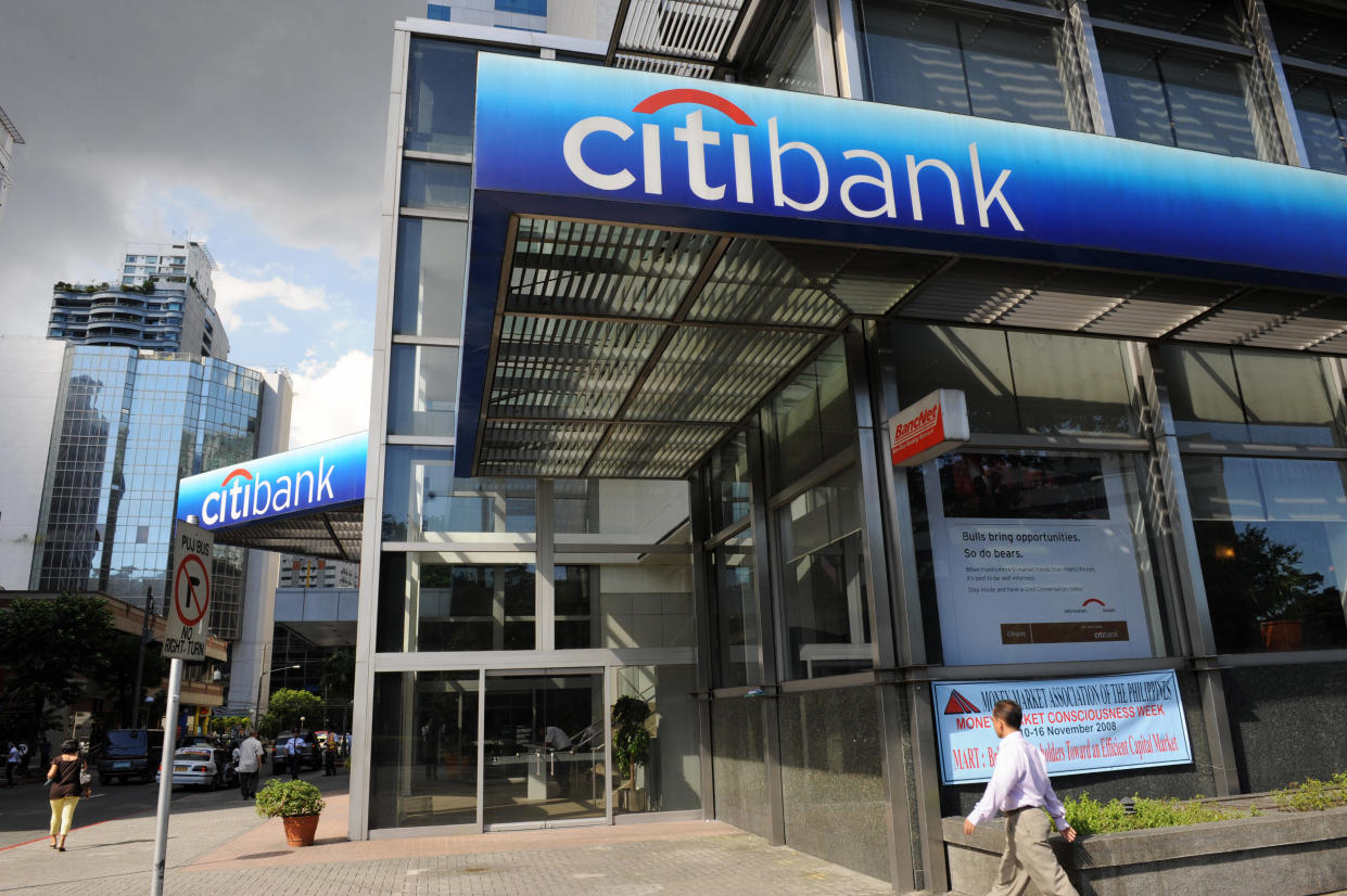 FILE PHOTO: A pedestrian walks in front of Citibank's office in the financial district of Makati suburban Manila on November 18, 2008. (Photo: ROMEO GACAD/AFP via Getty Images)