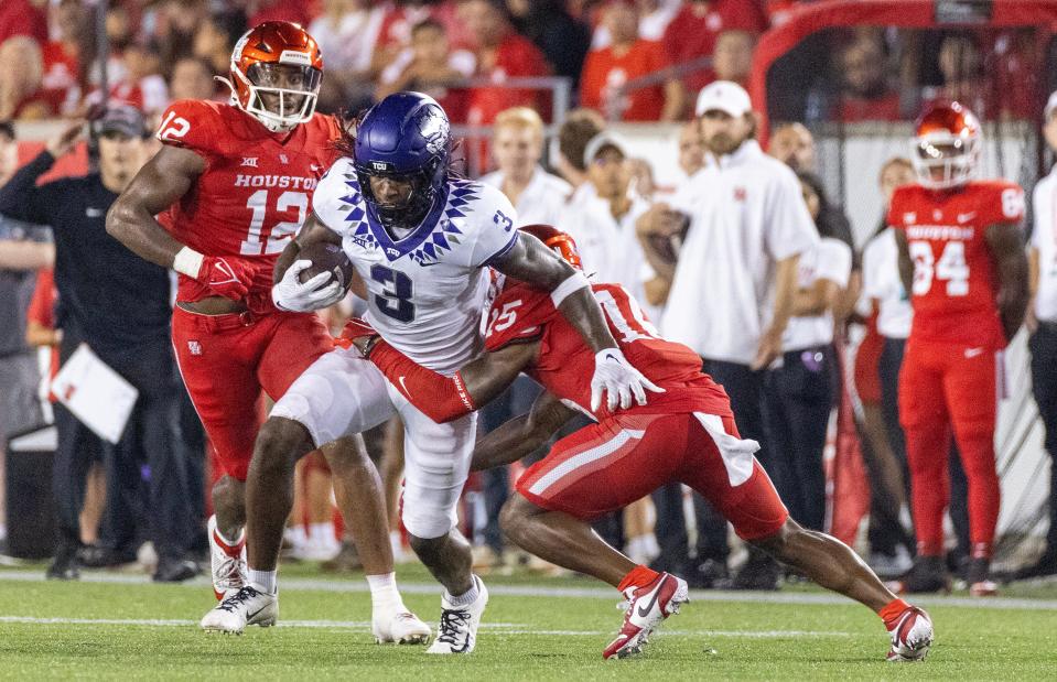 Sep 16, 2023; Houston, Texas, USA; TCU Horned Frogs wide receiver Savion Williams (3) rushes against the Houston Cougars defensive back Malik Fleming (15) in the second half at TDECU Stadium. Mandatory Credit: Thomas Shea-USA TODAY Sports