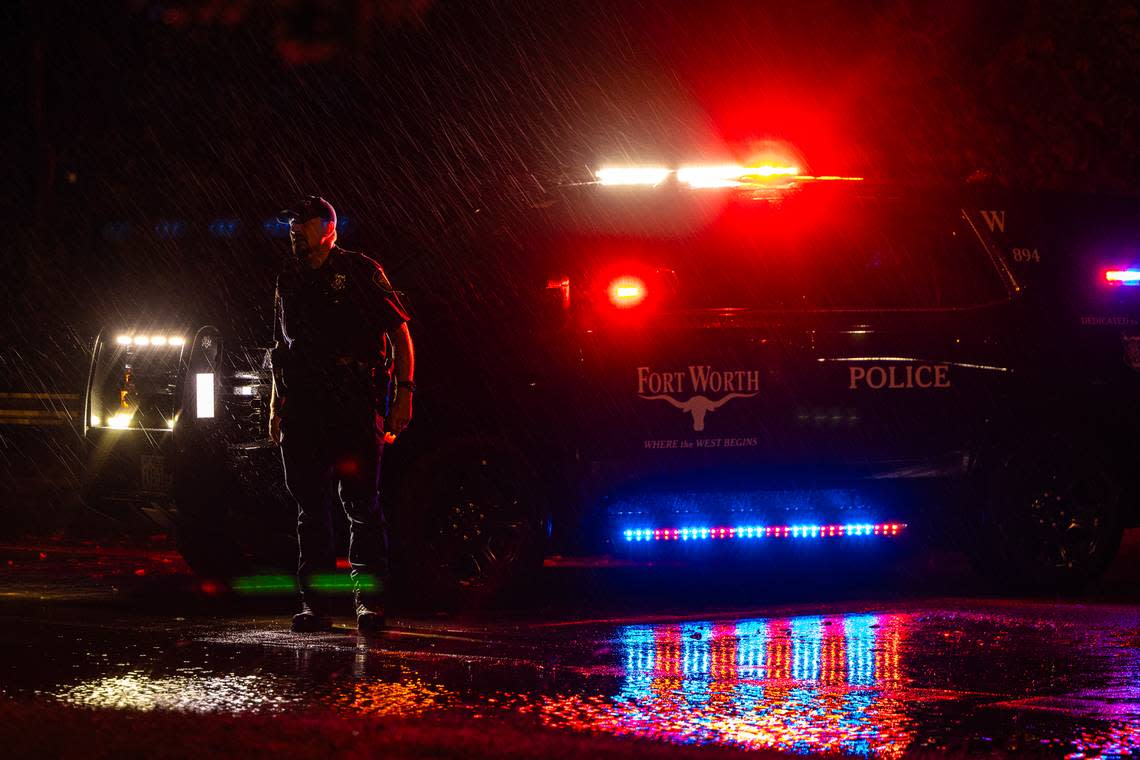 A Fort Worth Police Department officer closes a portion of W Vickery Boulevard due to flooding next to Collett Park in Fort Worth on Wednesday October. 4, 2023. Chris Torres/ctorres@star-telegram.com