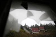 The disused ski jump from the Sarajevo 1984 Winter Olympics is seen through broken windows on Mount Igman, near Saravejo September 19, 2013. REUTERS/Dado Ruvic