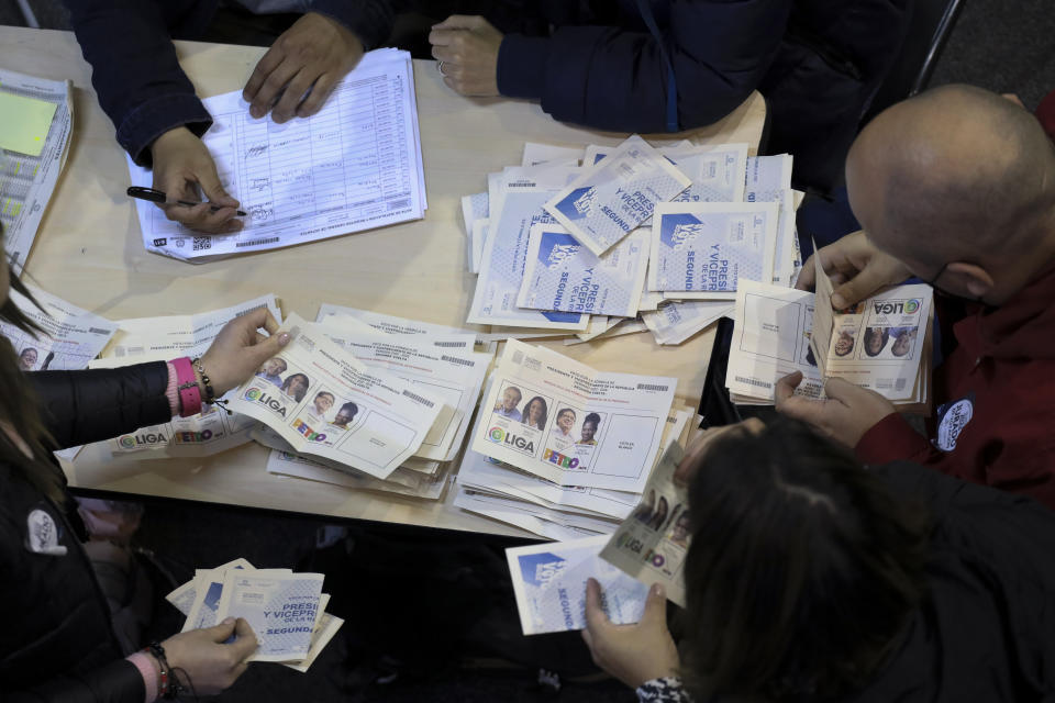 Electoral official count votes during a presidential runoff in Bogota, Colombia, Sunday, June 19, 2022. (AP Photo/Jaime Saldarriaga)