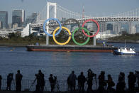 The Olympic Symbol is reinstalled after it was taken down for maintenance ahead of the postponed Tokyo 2020 Olympics in the Odaiba section Tuesday, Dec. 1, 2020, in Tokyo. (AP Photo/Eugene Hoshiko)